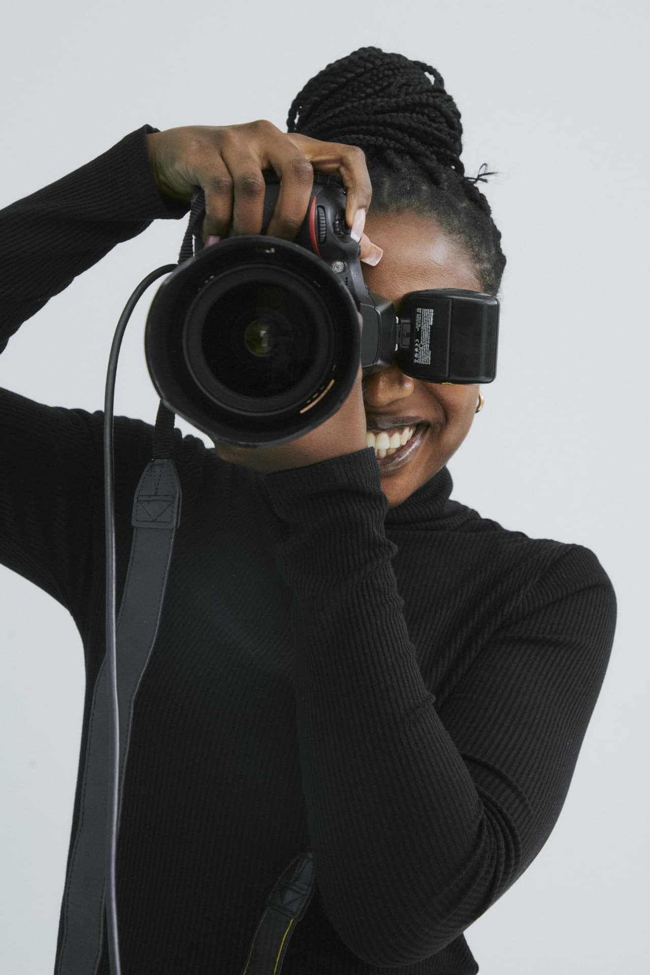 Photographer shooting with a DSLR camera