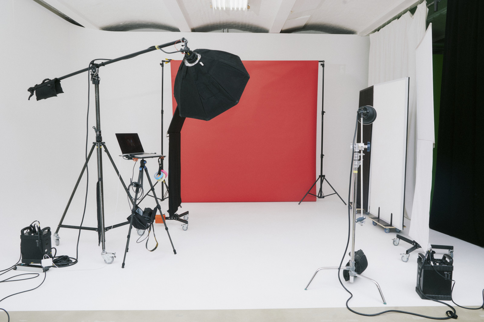 Photographer shooting a model on a studio backdrop